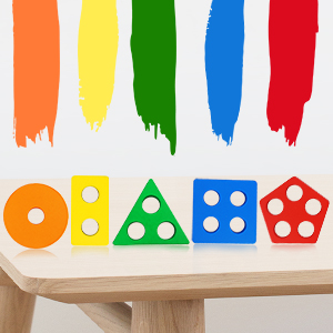 Toy sorter in the shape of a colorful wooden figure