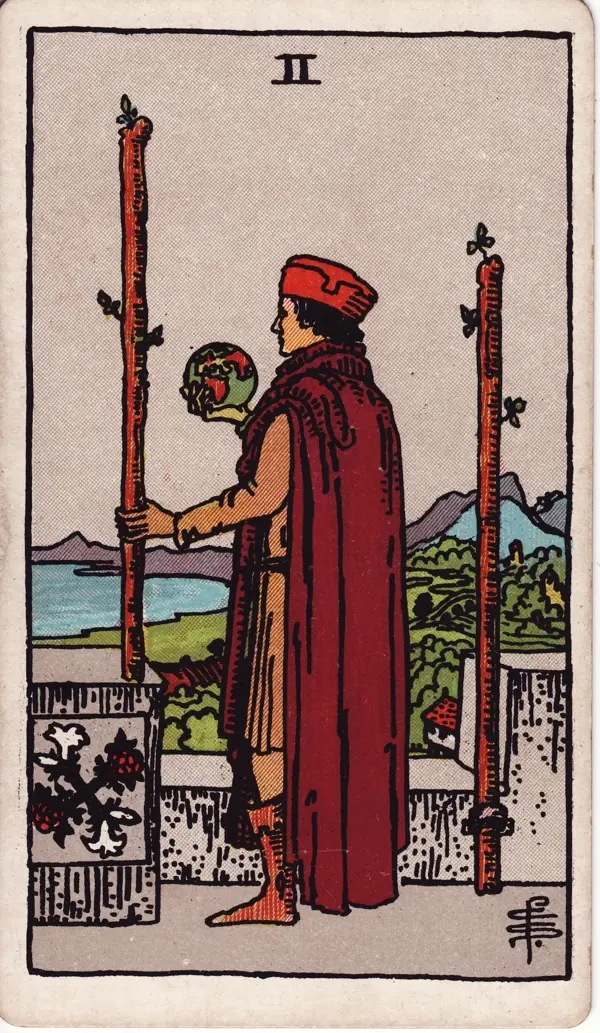 Two of Wands from the Rider-Waite-Smith deck, illustrated by Pamela Colman Smith.