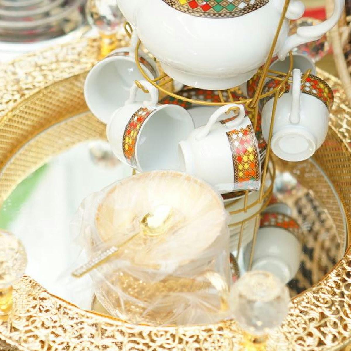 Ornate Porcelain Tea Set on Gold Display Stand