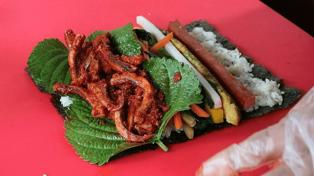 Spicy squid, egg, carrot, sweet radish, spinach, tempura.