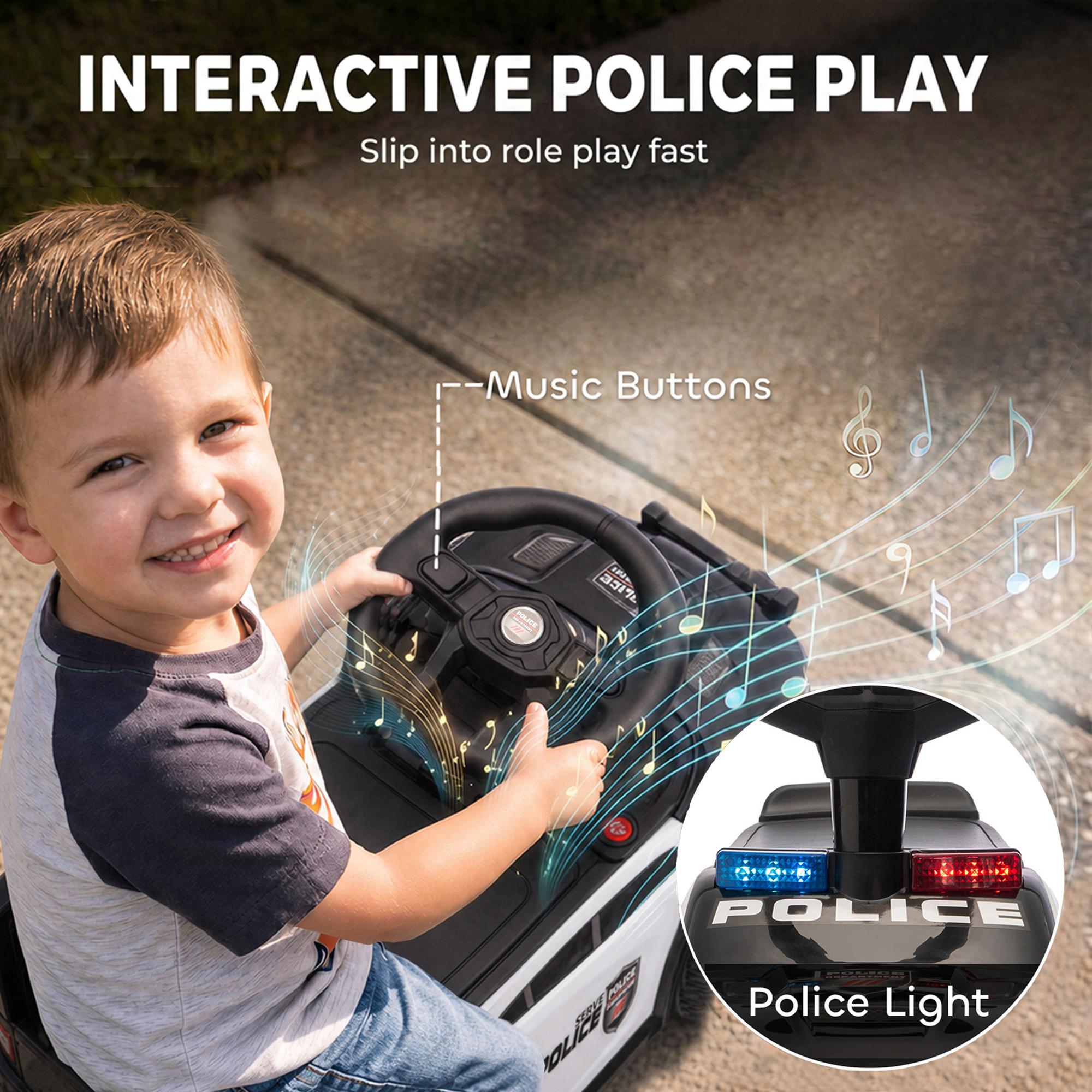 Child at the dashboard of a police push car with light-up beacon and music buttons