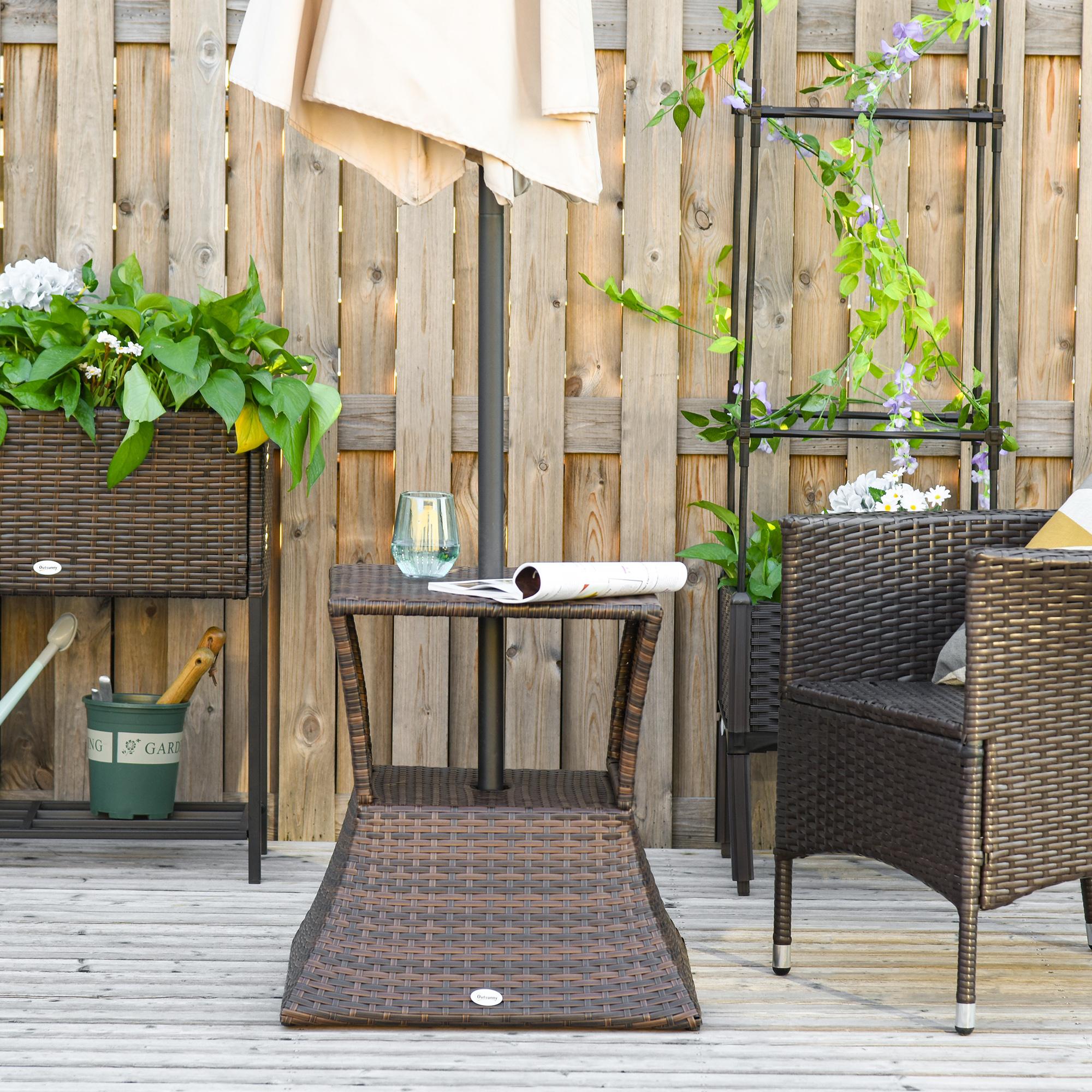 Mixed brown rattan side table in a patio seating area with umbrella pole